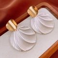 Macro detail of vintage gold curved earrings with pearlescent shell textured pendants - 31# Shell Pattern Pearlescent Round Earrings