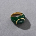 Macro shot of a 18k gold plated ring with malachite stone and deep green enamel finish - US 7 / Malachite Ring