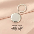 Polished silver stainless steel round photo locket keychain on pink satin background - Round Smooth Silver Tone (mp252)