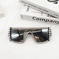 Detailed view of oversized sunglasses with multi-colored rhinestones and dark lenses - Silver Mirrored