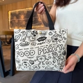 Cartoon canvas tote bag in cream white with black handles and food party print - Black and White Kaka