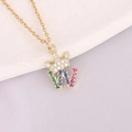 Close-up of crown and letter W pendant with colorful zircons and 18K gold finish - Letter W Style