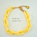Detail of yellow acrylic link bracelet with S.Steel heart tag and lobster clasp - Yellow