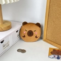 Cute brown plush capybara coin purse with zipper and metal keychain on a white desk - Shy Expression
