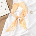 Orange silk scarf with leaf pattern and letter E tied as a stylish hair ribbon - Letter E - Orange Tropical Leaf