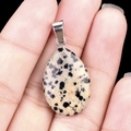 Dalmatian Jasper drop pendant with silver bail shown held for scale - Dalmatian Jasper (1pc)