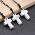 White marble cross necklace with grey veining and black adjustable braided cord - Howlite