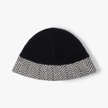 Thick knit bucket hat with black ribbed crown and black-white patterned brim for winter - Black