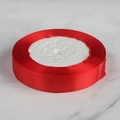 Polished red satin polyester ribbon roll on white marble for gift wrapping and DIY - 1.5cm Wide Satin Ribbon 22m