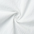 Macro shot of white cotton-linen fabric with textured pleats and soft woven structure - S / White (100% Cotton)