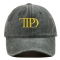 Close-up of yellow embroidered letters on a dark grey washed cotton baseball cap - One Size / Army Green