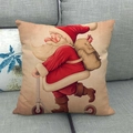 Housse de coussin en lin avec Père Noël sur scooter et chien sur canapé - Père Noël en Trotinette