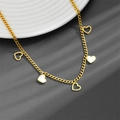Detail of gold stainless steel heart necklace featuring white shell inlays and cut-outs - Heart Necklace A603