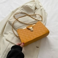 Yellow woven leather shoulder bag with gold clasp and chain strap in a stylish square shape - Yellow