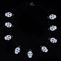 Macro view of 10-piece skull LED string lights with clear beads and black wires - 9 LED Skull Necklace