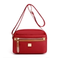 Waterproof red nylon crossbody bag with gold hardware and multiple zipper pockets - Burgundy
