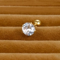 Macro detail of gold-plated round zircon stud earring with ball screw back on velvet - 6mm / Gold