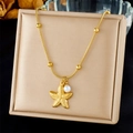 Detail of gold starfish pendant with white pearl on a delicate bamboo chain necklace - Gold Starfish With Pearl Charm (N3483)