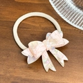 Elegant pink pearlescent acetate bow hair tie with a cream ribbed elastic band on wood - 5.4cm / Pink Hair Ring