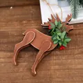 Handcrafted wooden reindeer ornament with green leaves and red berries on jute rope - Style E (Retro Brown with Berries & Leaves)