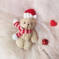 Cute beige plush bear keychain in red Christmas hat and scarf on soft tulle fabric - Brown Bear With Red White Scarf