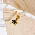 Golden star necklace with black enamel inlay and letter L on a beige stone surface - Letter L Style (D112)