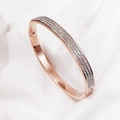 Detailed view of rose gold bangle with double-row shimmering pave-set crystals - Double Row Rhinestone / Rose Gold
