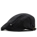 Detail view of black quilted cotton newsboy hat with silver M metal badge and embroidery - M (56-58cm) / Dark Gray