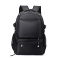 Close-up of black water-resistant sports backpack with hexagonal honeycomb texture and mesh pocket - 36-55L / Black