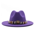 Detail of purple wool fedora hat featuring an ethnic beaded band and gemstone buckle - Purple
