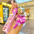 Purple lollipop floating glitter keychain with pink charms and unicorn wrist strap - Purple Luminous Snowflake Lollipop