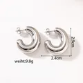 Detailed close-up of polished silver hollow C-shaped hoop earrings with butterfly backs - KC-E21 Silver Heavy C-Shape