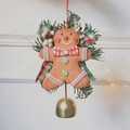 Gingerbread man ornament with pine branches, red plaid bow, and a golden bell - Large Red Green Plaid Gingerbread Man