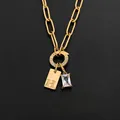 Gold titanium steel paperclip chain necklace with H-tag and crystal pendant detail - Letter H