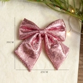 Pink sequin Christmas bow decoration 30x25cm on plush background with festive lighting - Pink 25X30CM Sequin Bow