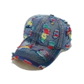Detailed view of distressed dark blue denim baseball cap with colorful frayed embroidery - M (56-58cm) / Blue