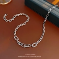 Silver chain necklace with zircon hollow square pendant on luxury leather background - Silver