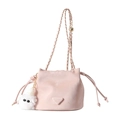 Pink drawstring bucket bag with gold chain strap and white plush charm on white background - Pink With Pendant