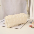 Creamy white quilted puff pencil case with wave texture and smooth zipper closure - Beige