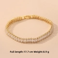 Luxurious gold tennis bracelet featuring rectangular cubic zirconia stones with security clasp - Rectangular Zirconia Bracelet