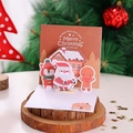 3D pop-up Christmas card featuring Santa Claus, gingerbread man and fox in a festive scene - Model H006 (Gingerbread House)
