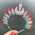 Detailed macro view of handmade rainbow crystal crown headband with silver moon pendant - Colorful