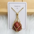 Golden mesh necklace with reddish-brown crystal stone pendant on white display card - Gold Red Jasper