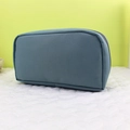 Detail of grey-blue fabric pencil case showing semi-circular design and sturdy zipper - Blue