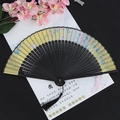 Classic Chinese folding fan with floral print, black ribs and matching silk tassel detail - Flower Rabbit Orange Black Handle