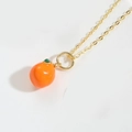 Detail of a 14K gold-plated necklace featuring a citrus orange pendant with green leaves - Orange
