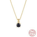 Detailed shot of S925 sterling silver gold necklace with a round blue birthstone pendant - Gold-September