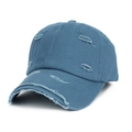 Close-up of distressed cotton baseball cap featuring raw edges and frayed hole details - Teal