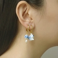 Detail of blue and white ceramic rabbit earring with gold hoop and white pearl charm - Porcelain Rabbit Set