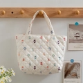 Borsa tote trapuntata bianco panna con stampe a cartoni animati e manici morbidi - Personaggio cartoon